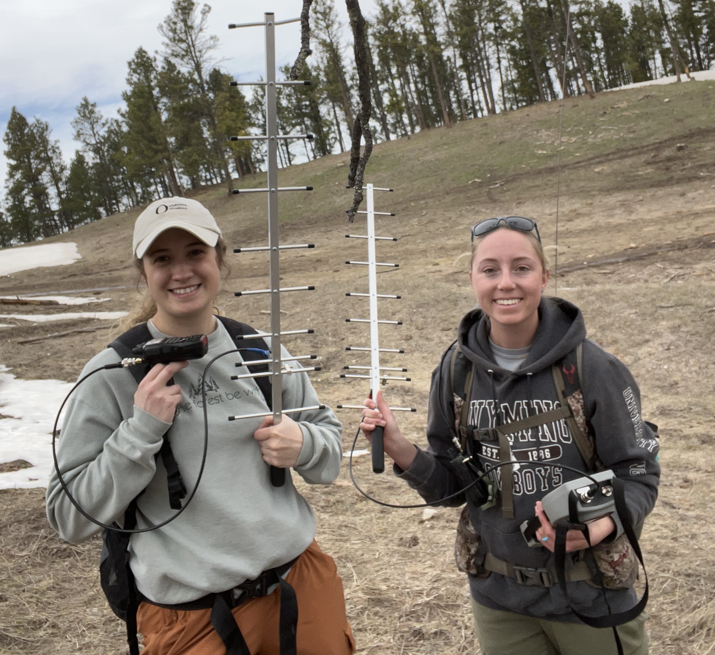Jade Wawers and Kayli Newkirk use telemetry equipment to track down tagged turkeys