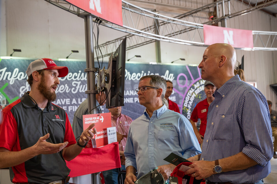 Andrew Little speaks with former Nebraska Governor Pete Ricketts at Husker Harvest Days